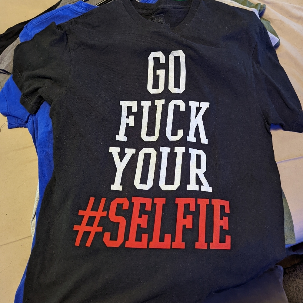 Black medium shirt with saying.